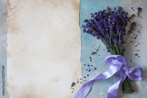 Background with bouquet of lavender, lilac bow and paper for text congratulations, wishes, invitation