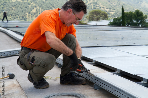 fitting photovoltaic panels on a roof