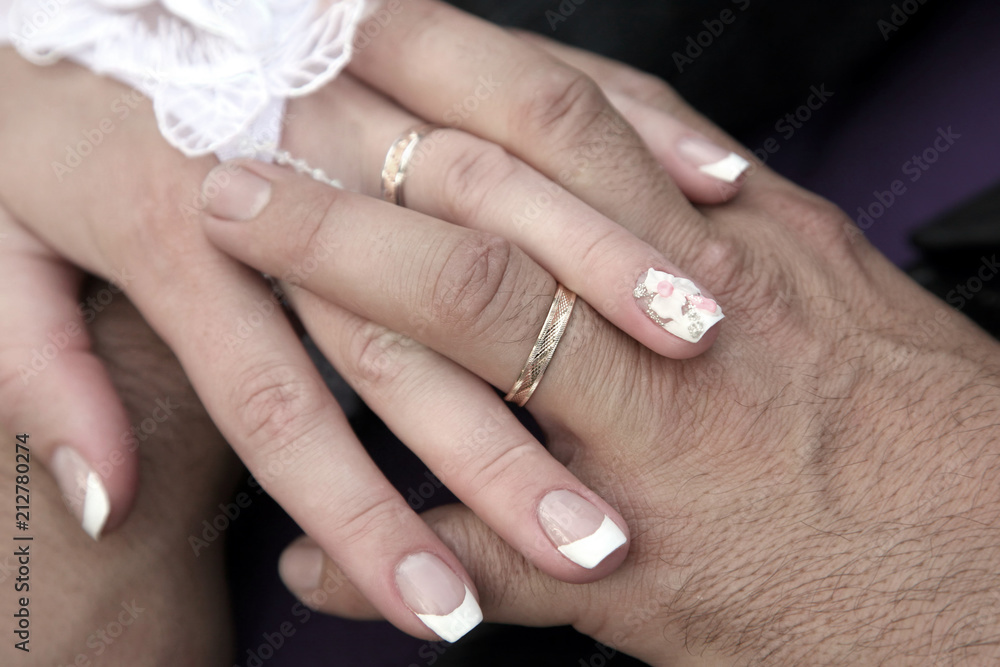 United hands of the bride and groom close up United hands of the bride and groom close up