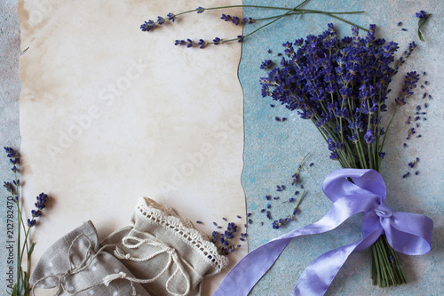 Fototapeta Naklejka Na Ścianę i Meble -  Background with lavender flowers, sachet bags and paper for text