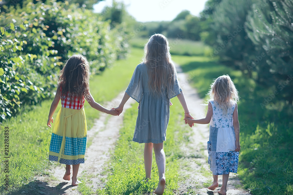 Fototapeta premium girlfriends funny children playing in the summer / group of girls having fun on a summer day, girlfriends children, summer vacation