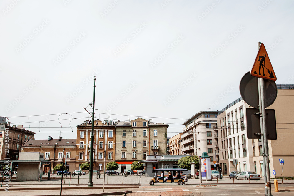 Obraz premium Street of the city of Krakow. The old Town. Public transport on the streets. Trams and buses. Polesha. City center.