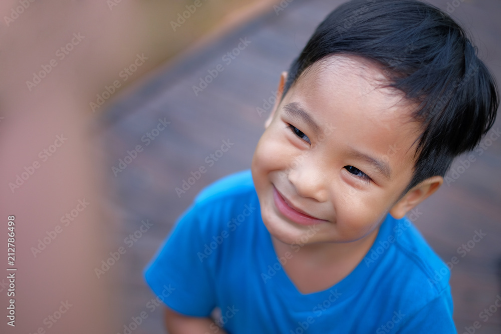 Top view of  little asian boy with blur background