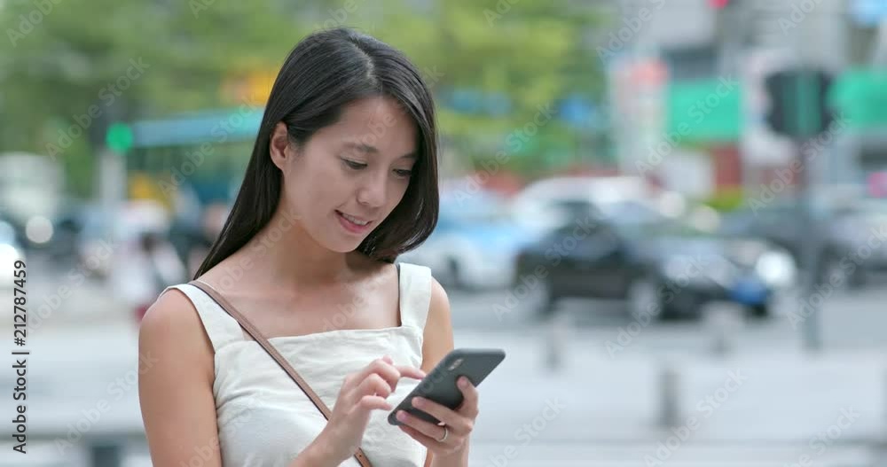 Woman use of cellphone at outdoor city Woman use of cellphone at outdoor city