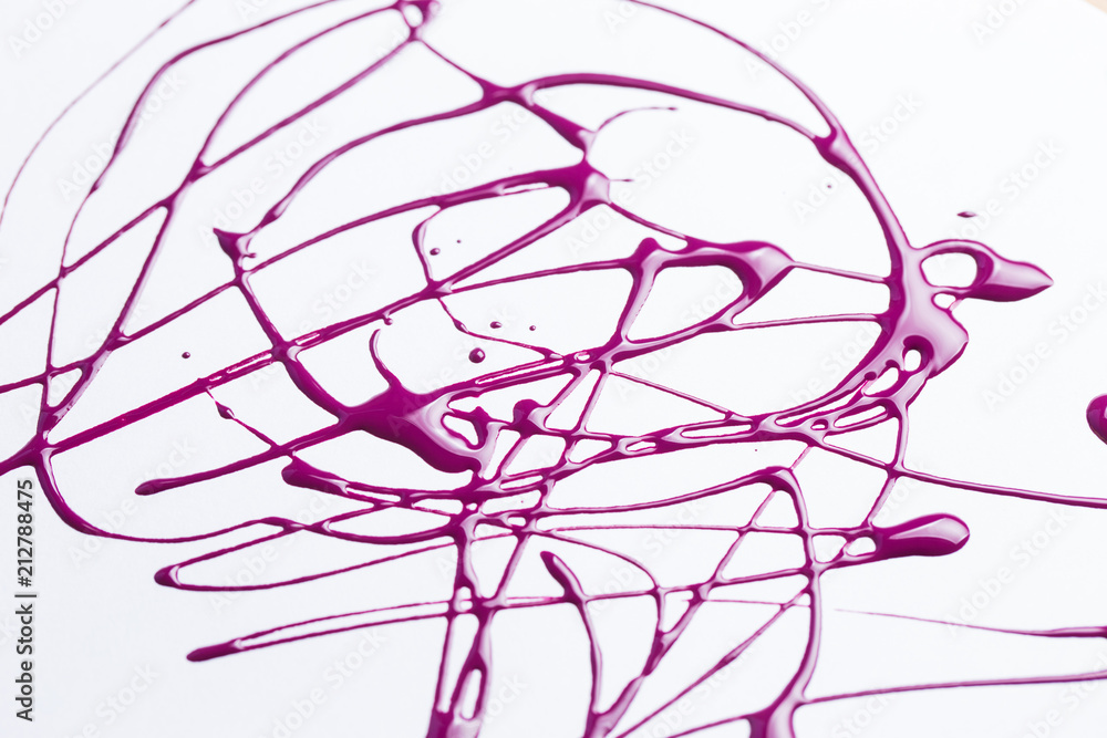 Nail polish on a white background in the form of strips and drops Nail polish on a white background in the form of strips and drops