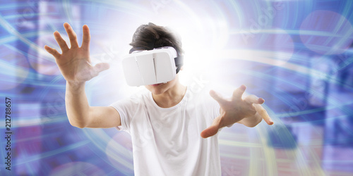 young man enjoying virtual reality glasses