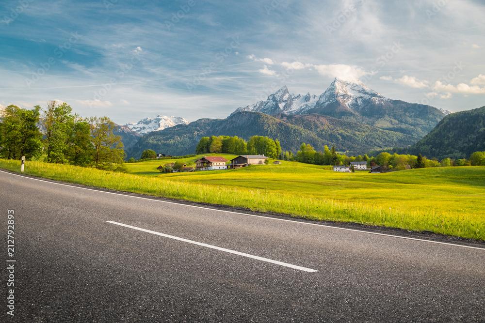 Empty asphalt country road with mountain scenery in summer