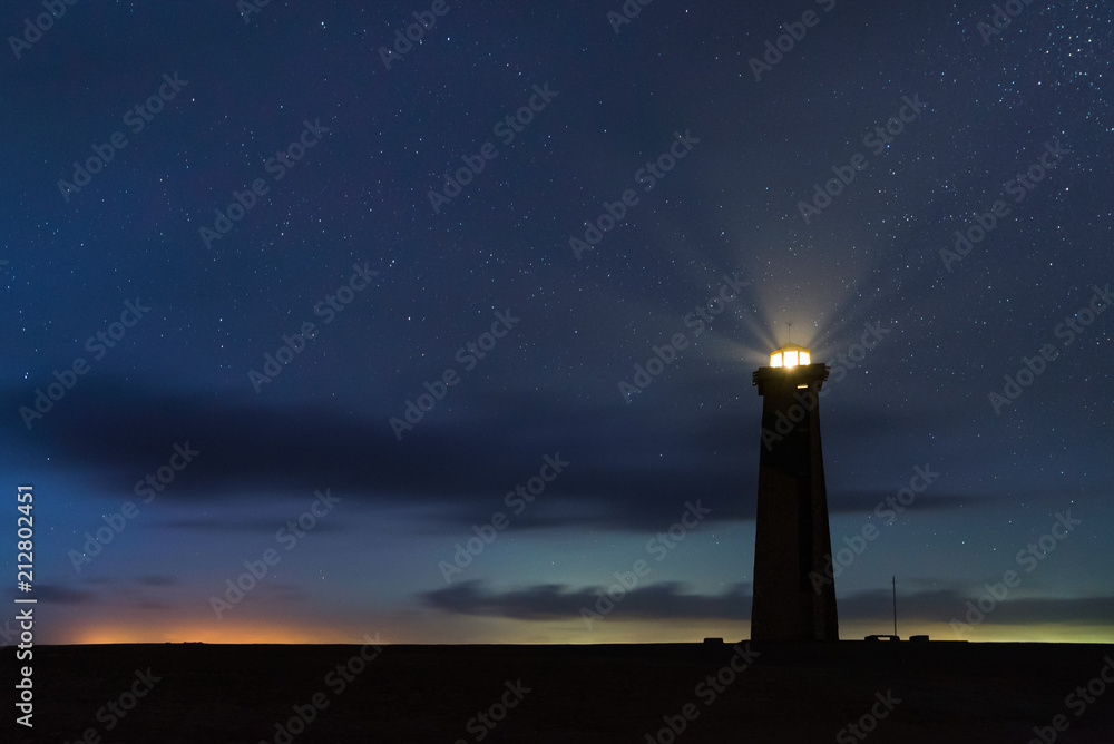 Panoramic View of San Roman Lighthouse at night with stars in Venezuela