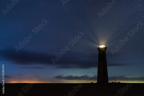 Panoramic View of San Roman Lighthouse at night with stars in Venezuela