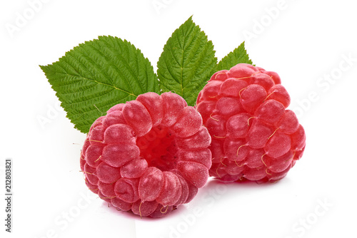 Fresh and ripe raspberry with leaves, isolated on white background. Close-up.
