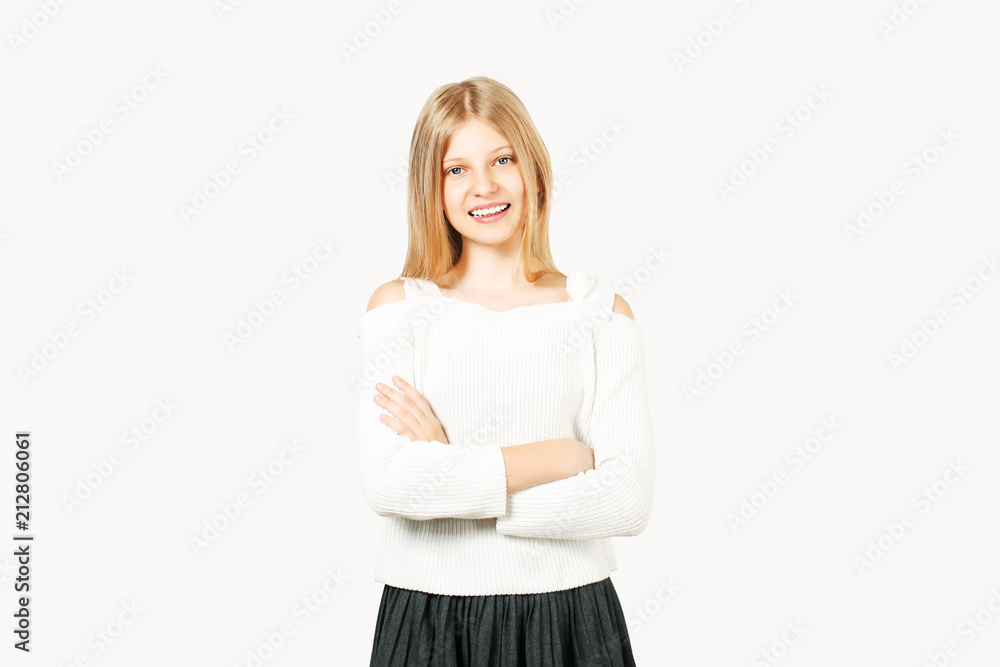 Portrait of young beautiful girl wearing school uniform. Blonde teenage schoolgirl student female smiling with perfect white teeth. Background, copy space, close up. Back to school sale concept. Portrait of young beautiful girl wearing school uniform. Blonde teenage schoolgirl student female smiling with perfect white teeth. Background, copy space, close up. Back to school sale concept.