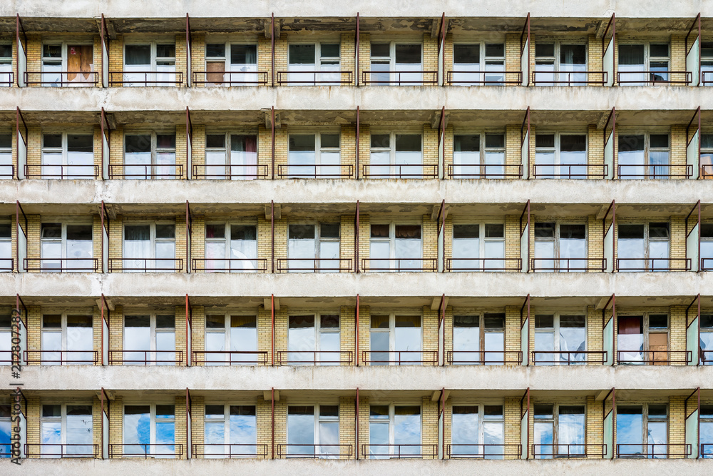rows of windows in fasade of an abandoned building rows of windows in fasade of an abandoned building