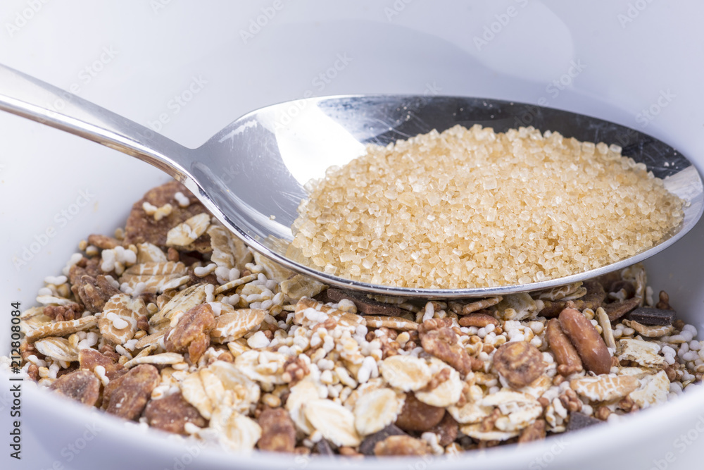 a spoonful of brown sugar on a mountain of chocolate muesli a spoonful of brown sugar on a mountain of chocolate muesli
