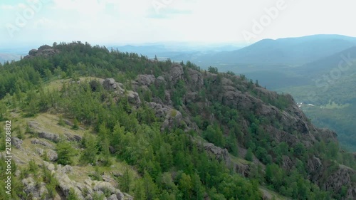 Aerial View. Flight over a greenrocky hills. Bashkortostan, Bannoe, Russia. photo