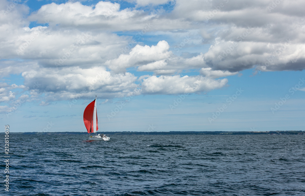 Fototapeta premium Sailing boat in the sea. Red sails
