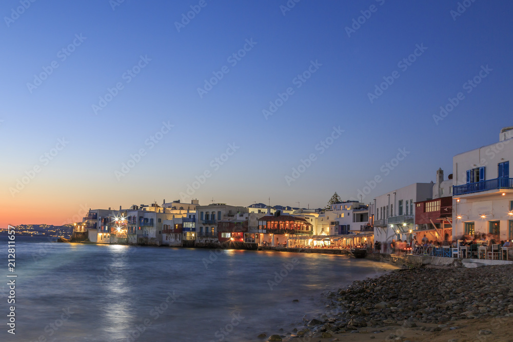 Little venice from beach in old town part of Mykonos, Greece during sunset