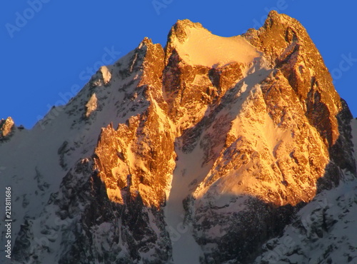 Snow peak mountains at sunset Caucasus Cheget-Kara Mt
