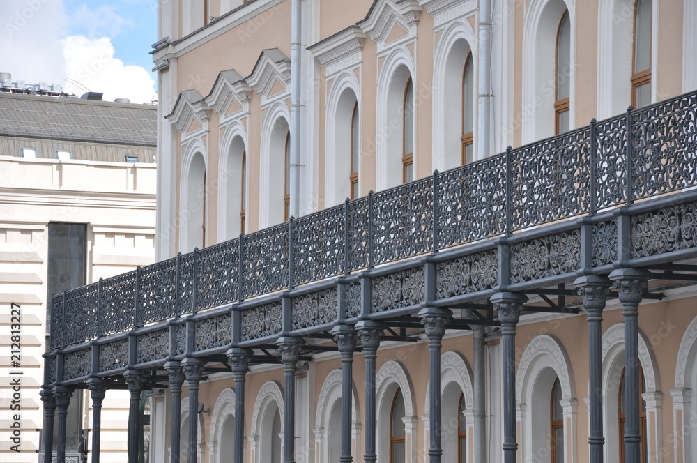 cast-iron cast fence on the balcony of the building cast-iron cast fence on the balcony of the building