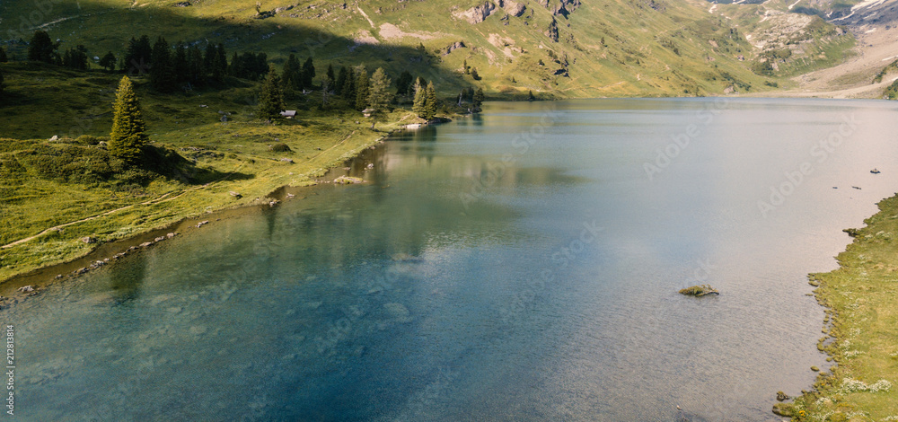 Mountain lake with a green meadow Mountain lake with a green meadow