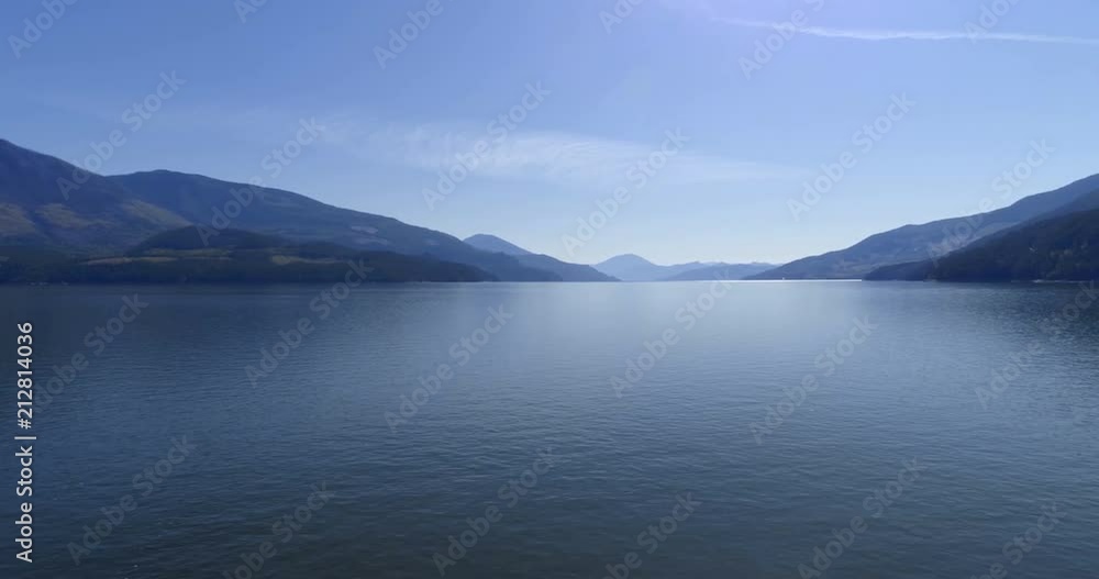Beautiful lake surrounded by rocky mountain range 4k Beautiful lake surrounded by rocky mountain range 4k