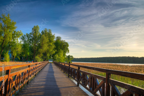 Fototapeta Naklejka Na Ścianę i Meble -  Squirrel path in Olecko -  route around the Olecko Wielkie Lake. View from the lake. Masuria, Poland.