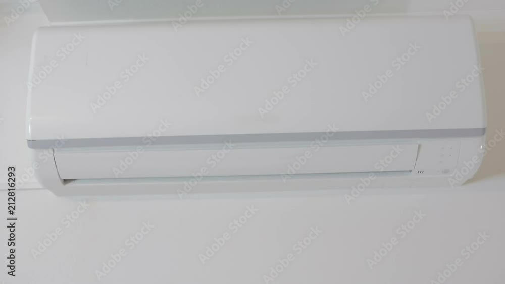 The hand with the remote control includes a domestic conditioner