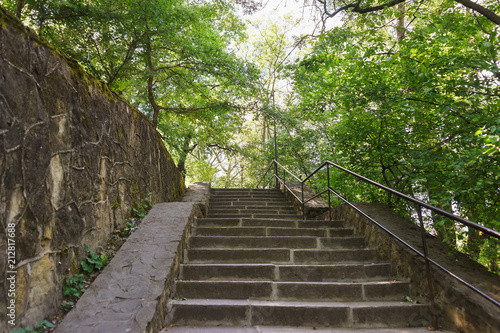 Old stone staircase in the shady Park of the southern village of Abrau-Durso in the Caucasus mountains