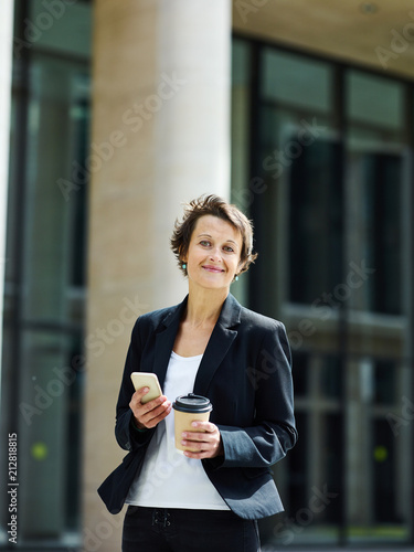 Charming adult executive woman outdoors © Comeback Images
