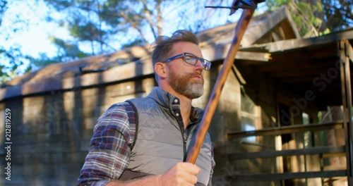 Wallpaper Mural Male logger holding axe in the forest 4k Torontodigital.ca
