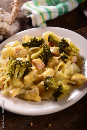 Pasta with broccoli and chicken with cheese sauce