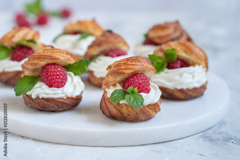 Raspberries Profiteroles with White Chocolate cream Raspberries Profiteroles with White Chocolate cream
