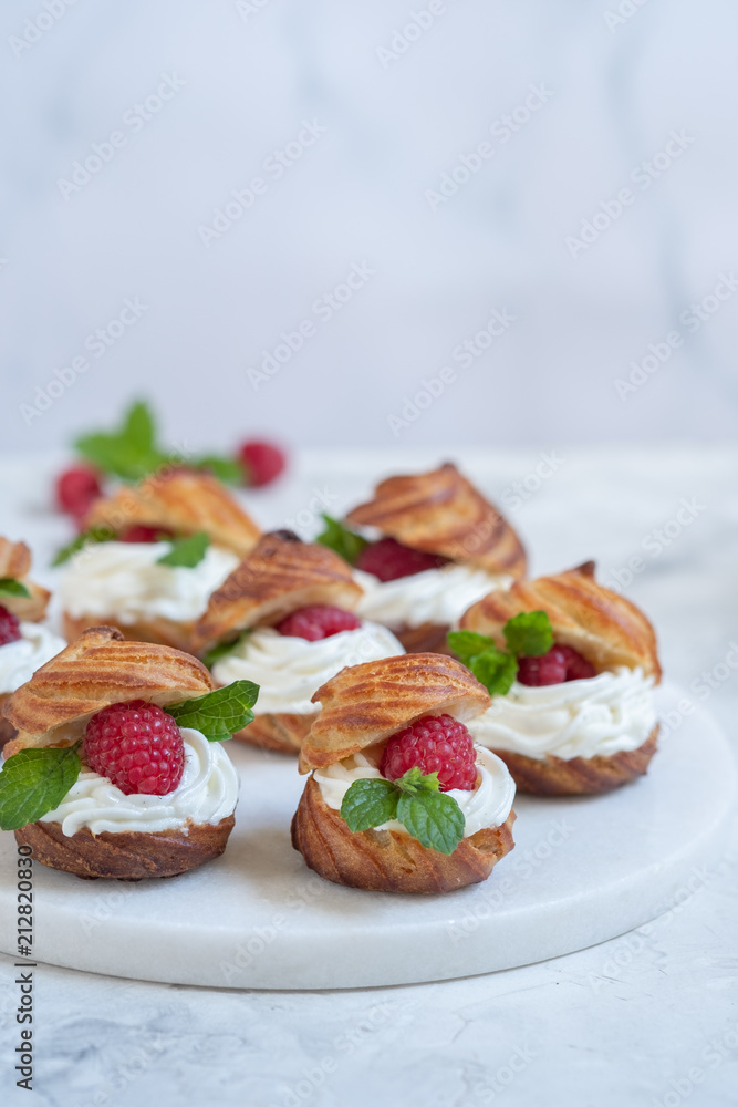 Raspberries Profiteroles with White Chocolate cream
