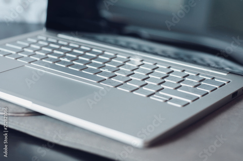 Laptop on the desk close-up. Buttons on the keyboard in focus