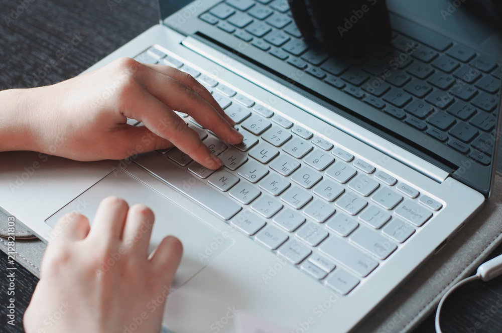 Woman's fingers on the keyboard buttons Woman's fingers on the keyboard buttons