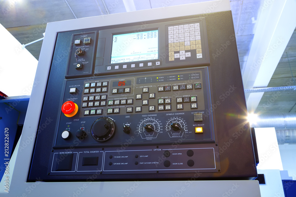Fototapeta premium Close up of control panel of CNC machine with adjustment controls and push buttons