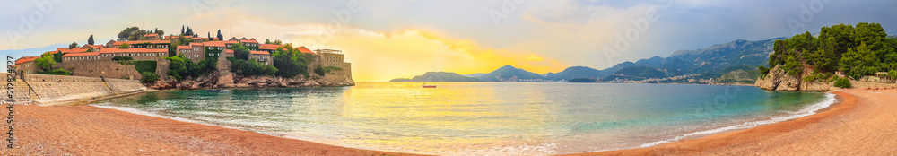 Panoramic view to the awesome sunset around famous island Sveti Stefan and Adriatic sea coastline in Montenegro, gorgeous summer seascape