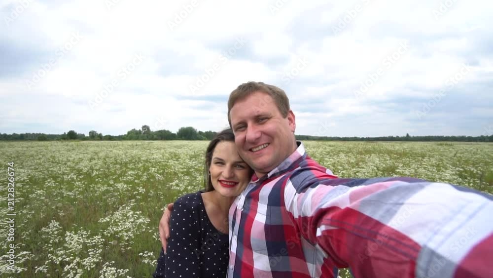 Romantic Happy Couple In Love Taking Photos On Phone In Nature. Romantic Happy Couple In Love Taking Photos On Phone In Nature.