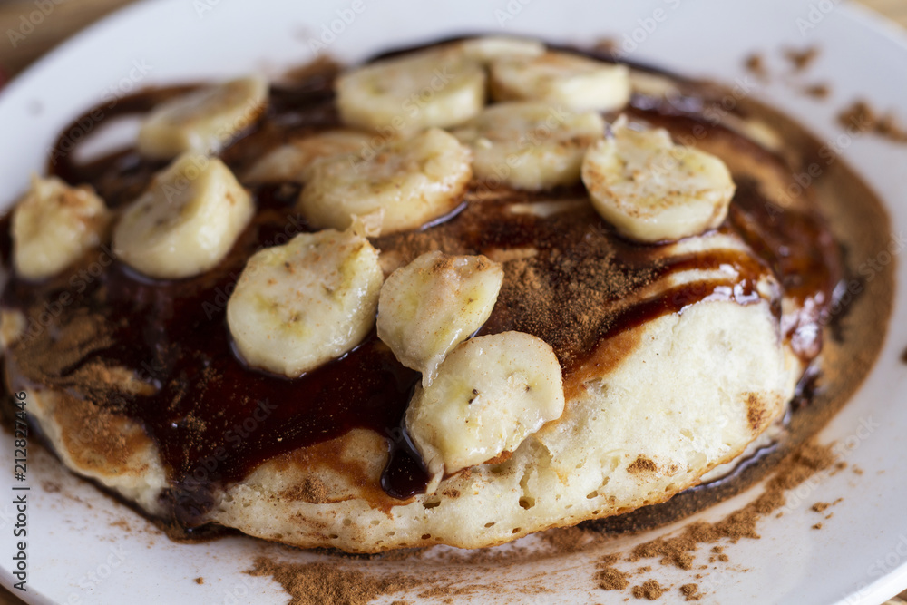 Sweet pancake with banana and chocolate. Banana chocolate dessert flat lay. Sweet kids breakfast. Sweet pancake with banana and chocolate. Banana chocolate dessert flat lay. Sweet kids breakfast.