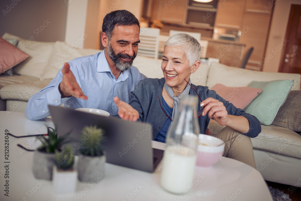 Mature couple using laptop Mature couple using laptop