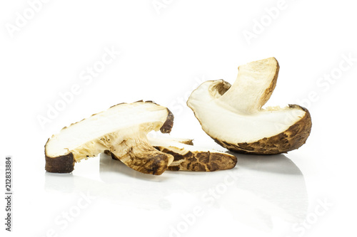 Group of one half two slices of fresh raw brown shiitake mushroom isolated on white.
