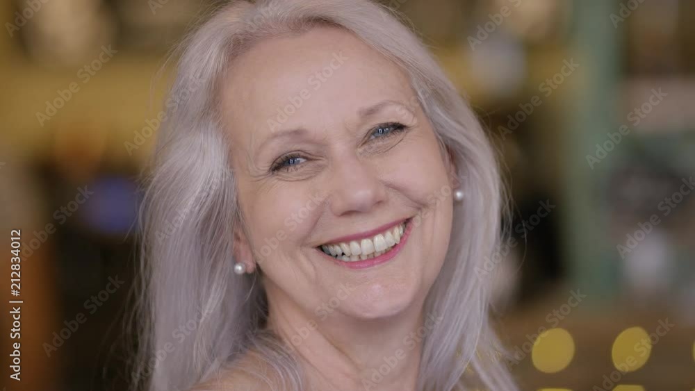 Portrait of happy smiling mature lady looking to camera Portrait of happy smiling mature lady looking to camera