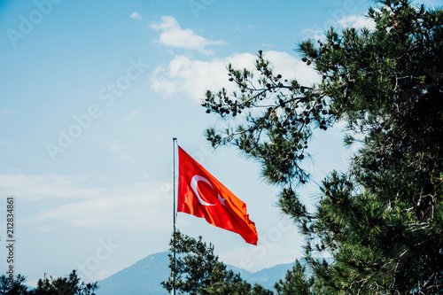 Turkish flag against the sky. Alanya, Turkey. Wonderful country.Blue sky. Sunny Turkey.