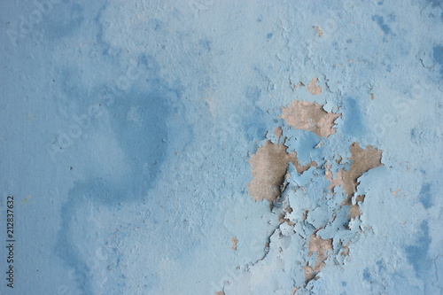 Canvas Print Peeling wall paint, moist damp texture on house wall with some water stain and l