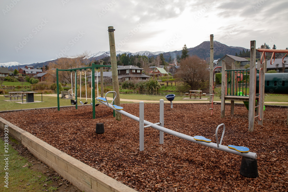 A modern playground with bark chips in a resort town