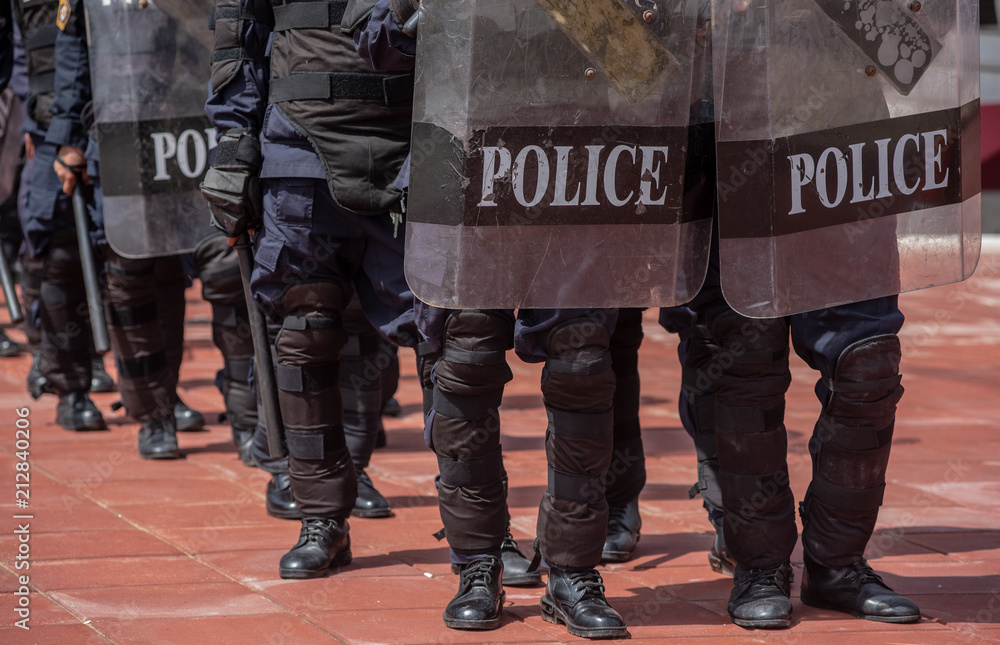 Riot police control the crowd.. Riot police control the crowd..