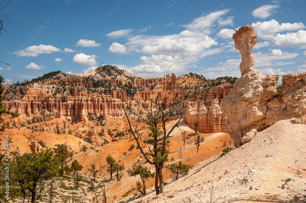 Partly cloudy sky throws shade and sunlight, Bryce Canyon, Utah