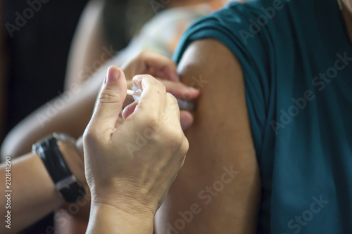 Doctors provide vaccinations to the public to help prevent influenza. Prevention concept