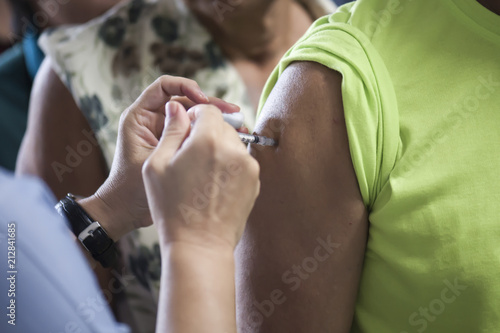 Doctors provide vaccinations to the public to help prevent influenza. Prevention concept