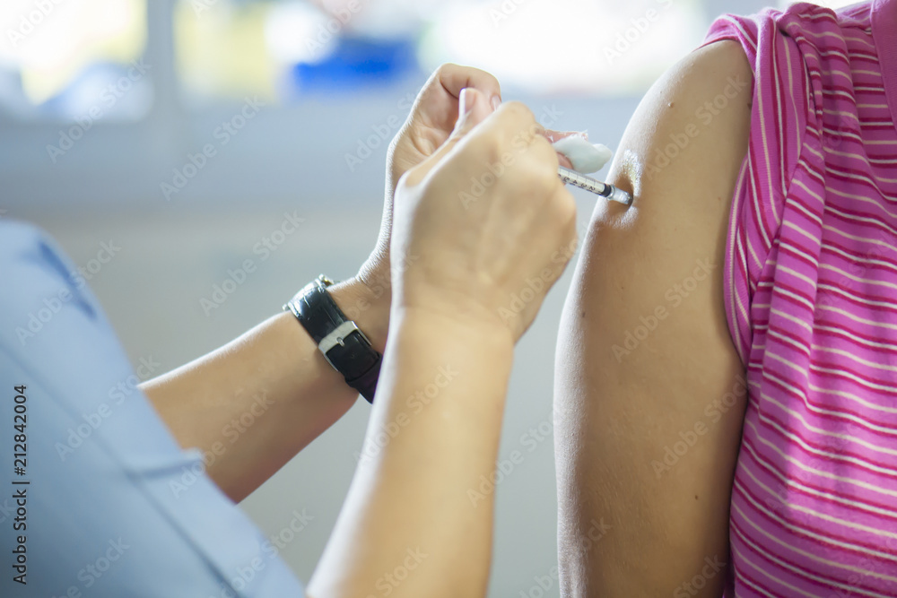 Doctors provide vaccinations to the public to help prevent influenza. Prevention concept