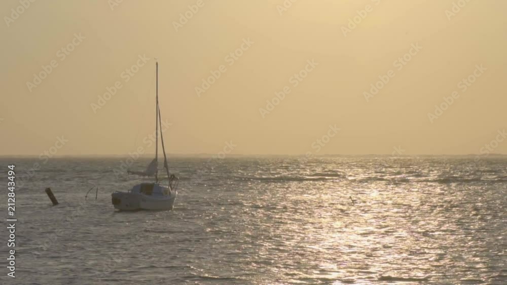 Boat Drifting In The Ocean. Sunset Boat Drifting In The Ocean. Sunset
